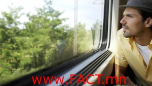 Man Looking Out Train Window