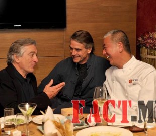 U.S. actor Robert De Niro talks with British actor Irons and Japanese chef Matsuhisa during the official opening of Nobu restaurant in Budapest