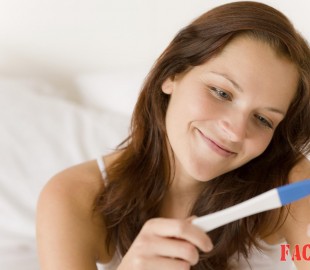 happy-woman-with-pregnancy-test