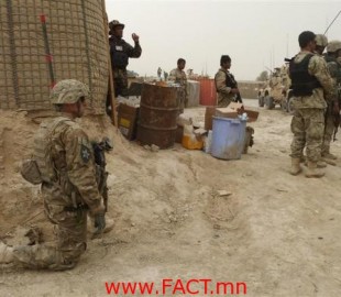 U.S. soldiers keep watch at the entrance of a U.S. base in Panjwai district Kandahar