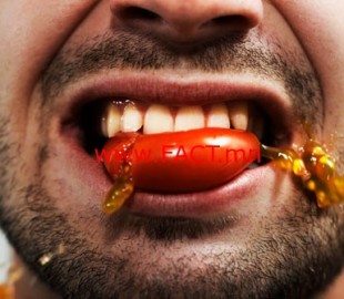 getty_rm_photo_of_man_biting_tomato