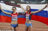 Winner Kuchina of Russia celebrate with her third placed compatriot Chicherova after competing in the women's high jump final during the 15th IAAF World Championships at the National Stadium in Beijing